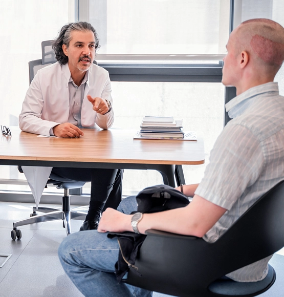 dr ekrem civas talking with hair transplant patient after operation