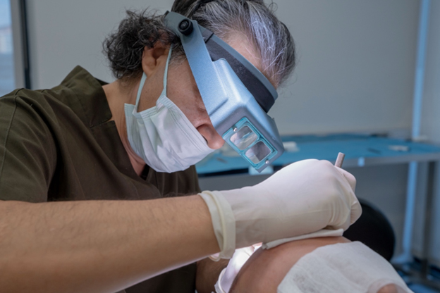 Hair Transplant Turkey Techniques: Doctor making incisions during FUE Hair Transplant